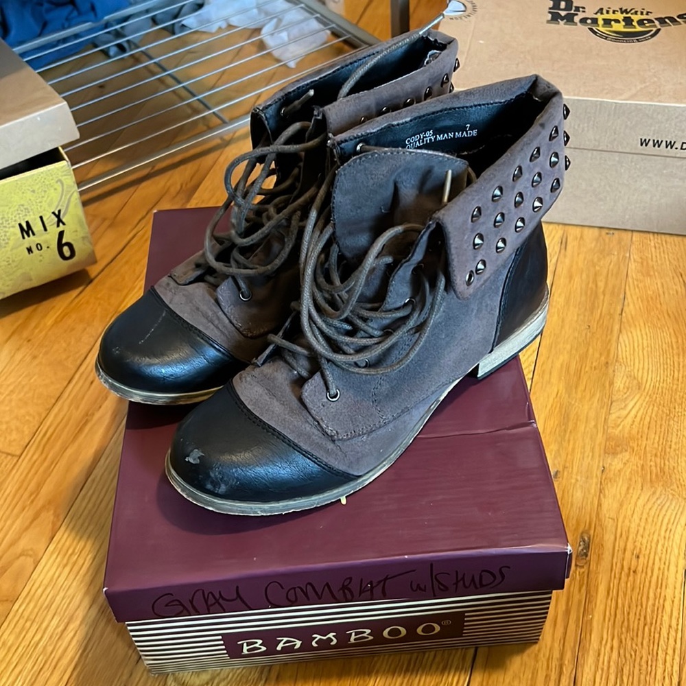 Grey and black studded combat boots